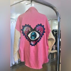 Custom mineral-washed pink denim cable knit sweater-sleeve and evil-eye heart